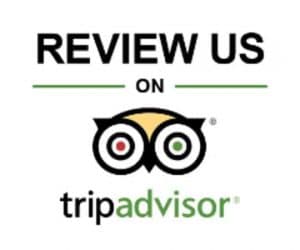 TripAdvisor badge with Review Us text in black and green