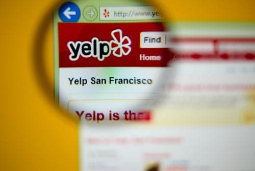 Yelp San Francisco page magnified through a lens