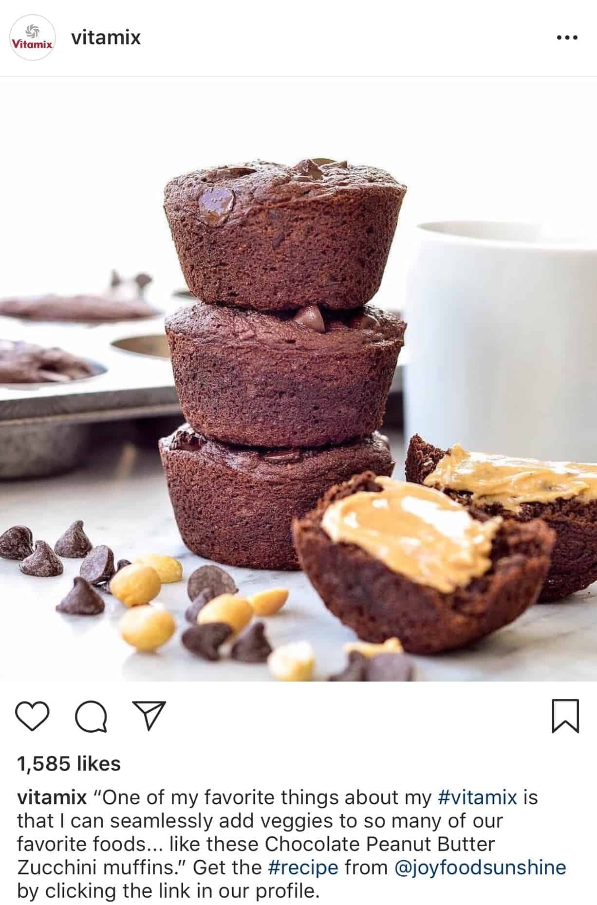 Vitamix Instagram post featuring three stacked chocolate peanut butter zucchini muffins with scattered chocolate chips