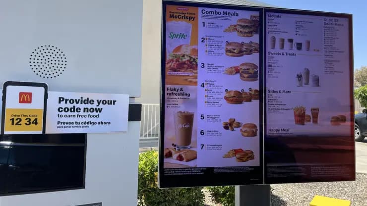 McDonald's digital menu board displaying combo meals and drive-thru ordering kiosk