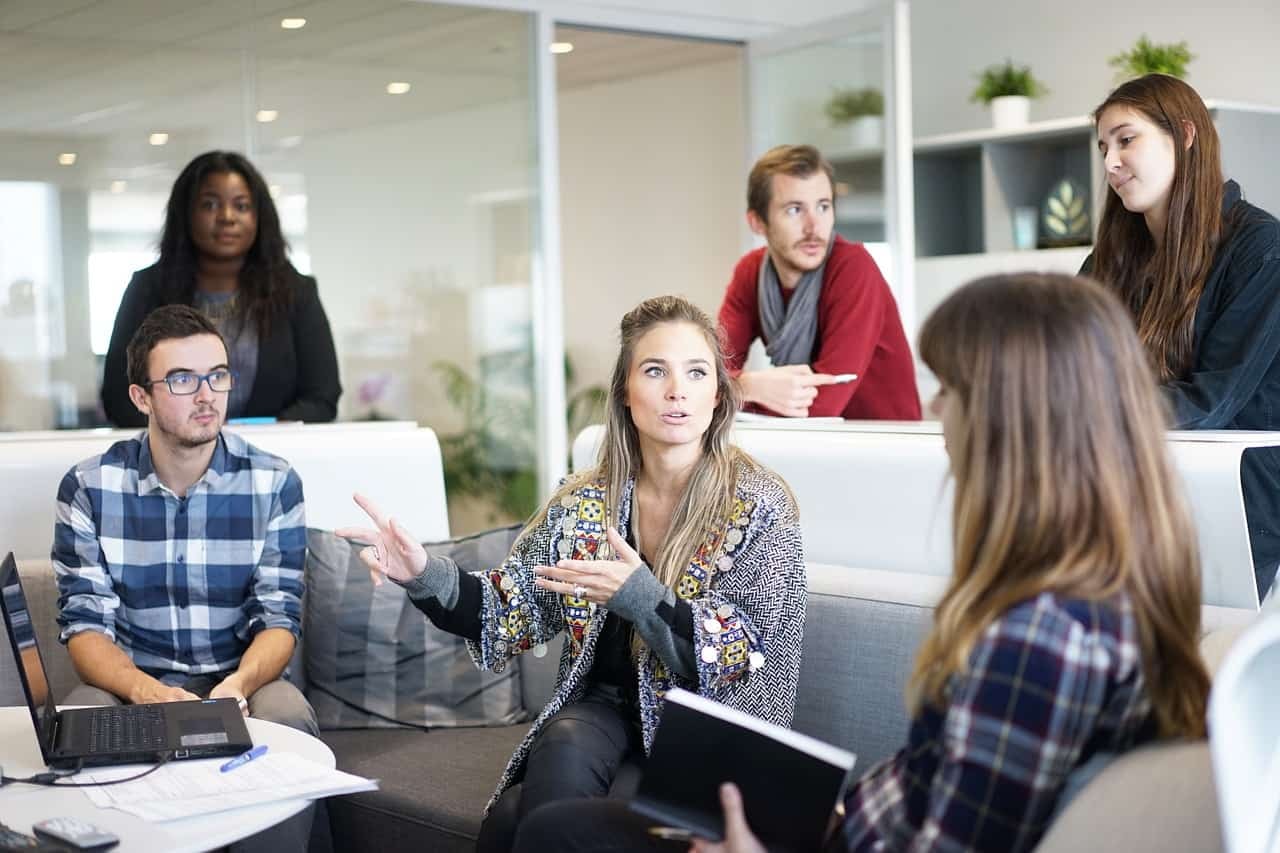 Team in modern office discussing strategy and sharing ideas